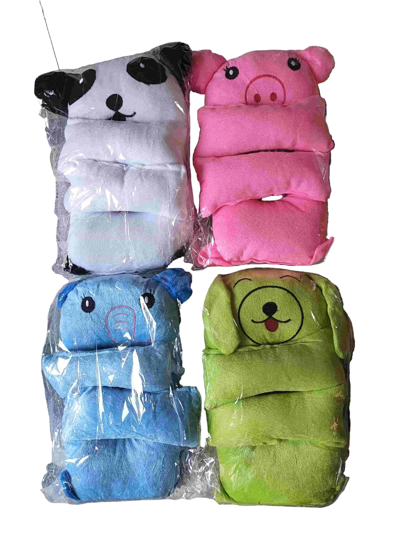 Four animal-themed baby diapers in plastic packaging on a patterned surface.