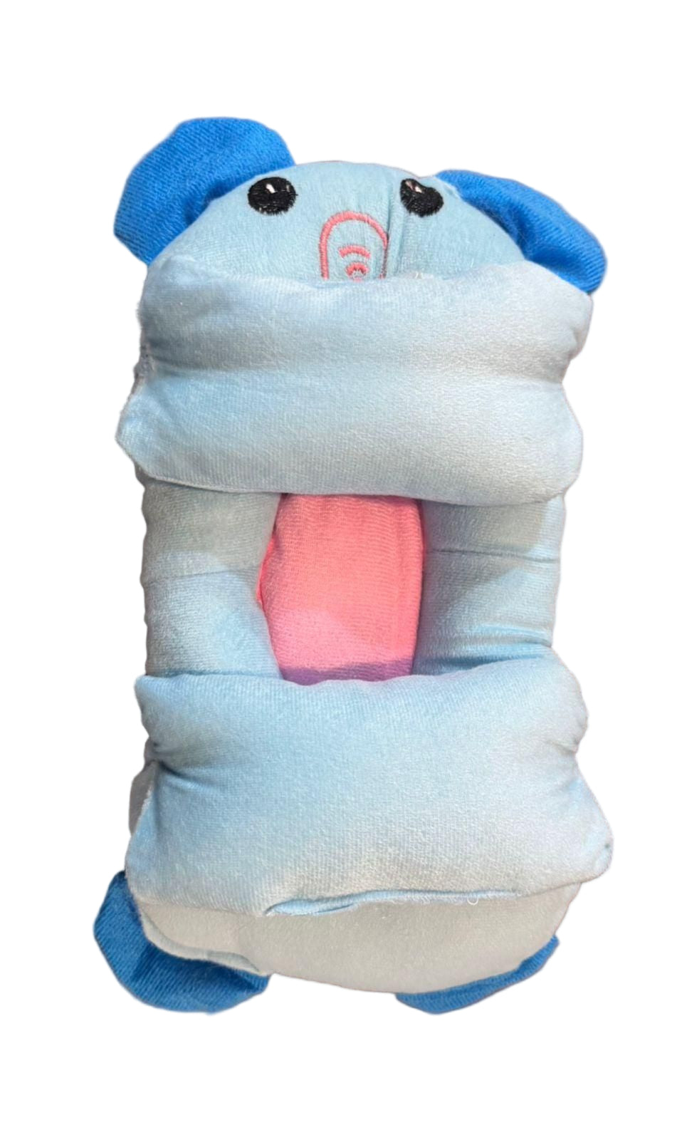 Plush toy resembling a cartoon character on a wooden surface